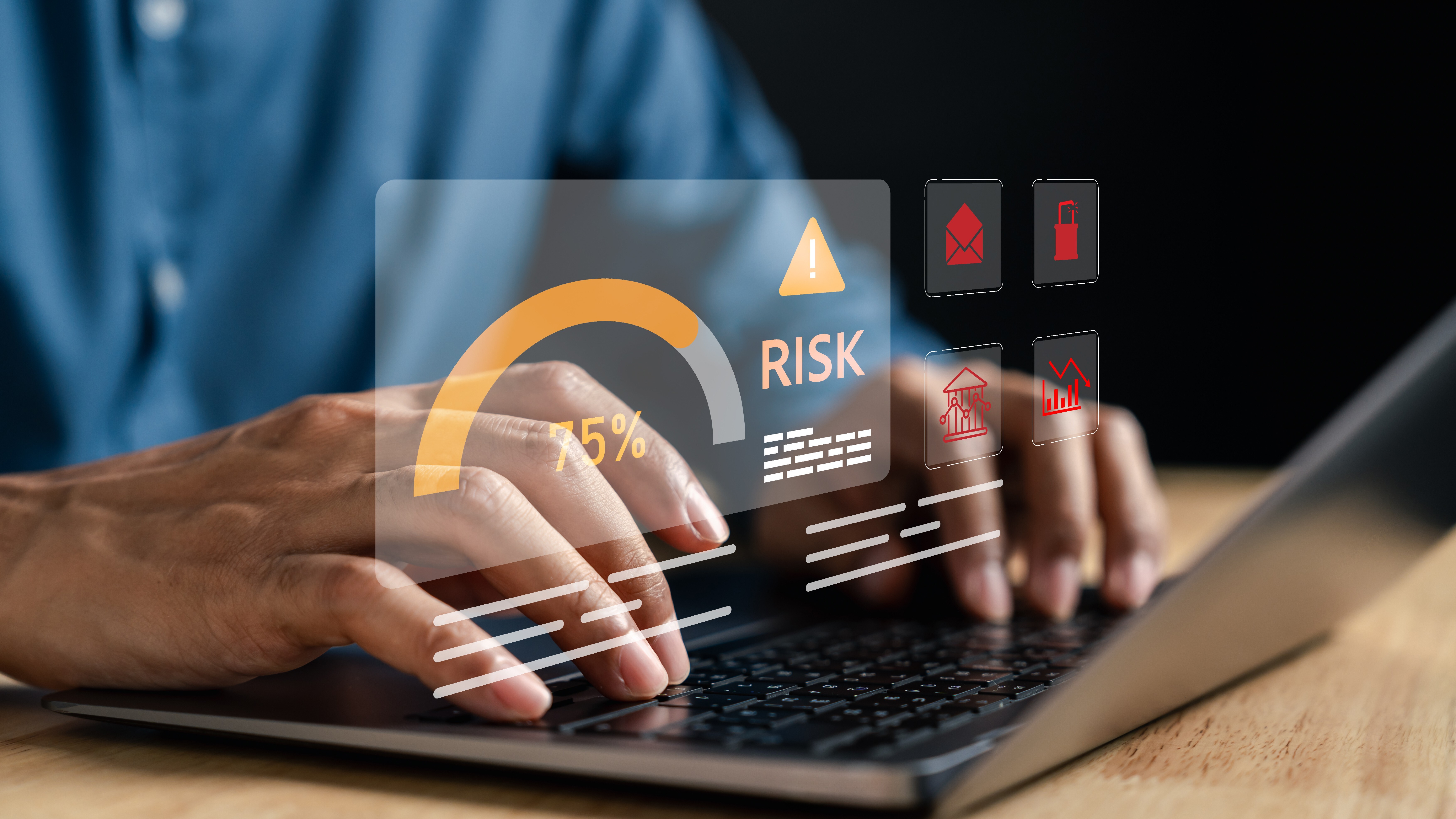 Laptop displaying a security alert with icons representing digital risks and data protection.