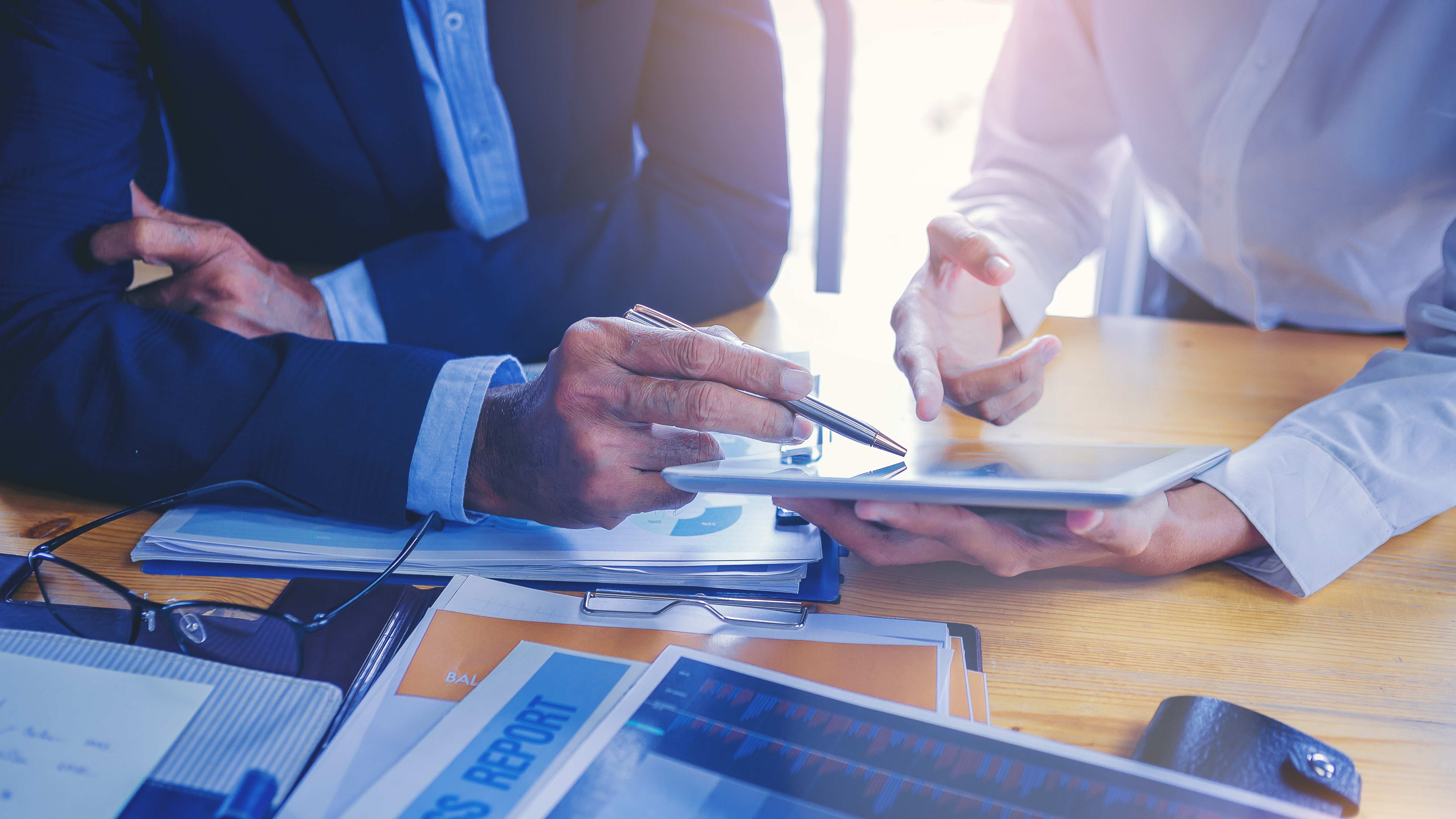 businesswoman working with touchpad has been guided and consulting by senior colleague