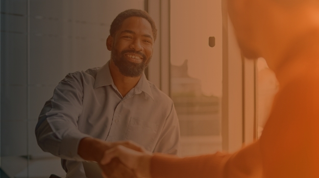 businessmen shaking hands and smiling during a meeting, celebrating a successful deal and new professional partnership